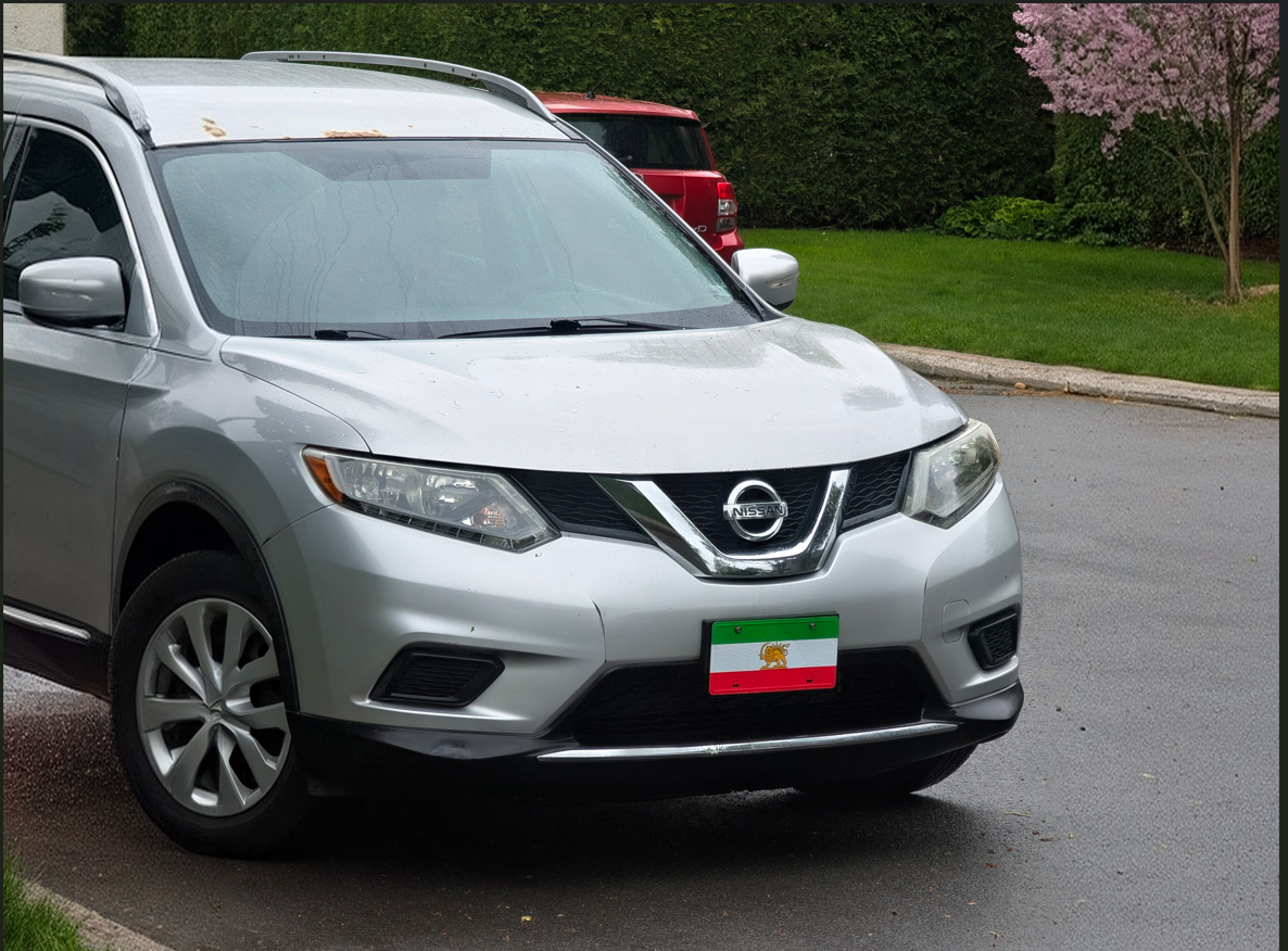 Lion and Sun license plate displayed on car Persian heritage